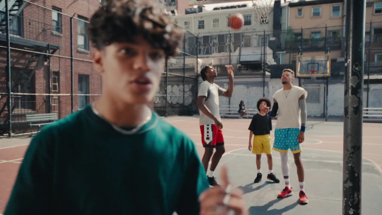 Kids shooting hoops on a New York court