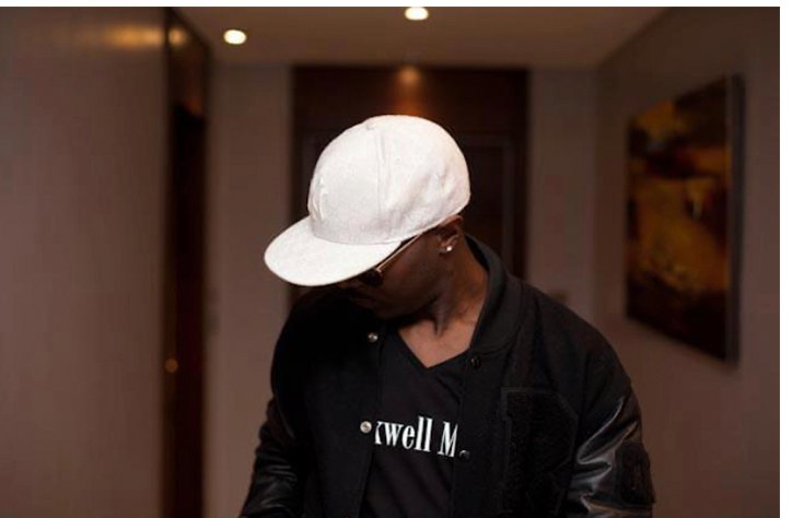 Rockwell in a white cap